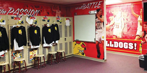 Bold wall wrap featuring motivational quote and school colors, showcasing how locker room graphics energize team spaces.