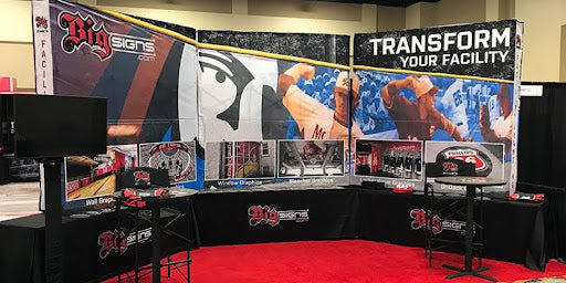 Bold event banners and branding graphics designed by BigSigns for a professional event setup.