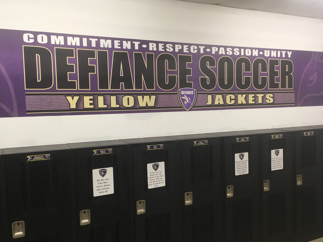 Soccer locker room showing benches, cleats, and uniforms ready, evoking teamwork, preparation, and athletic readiness.