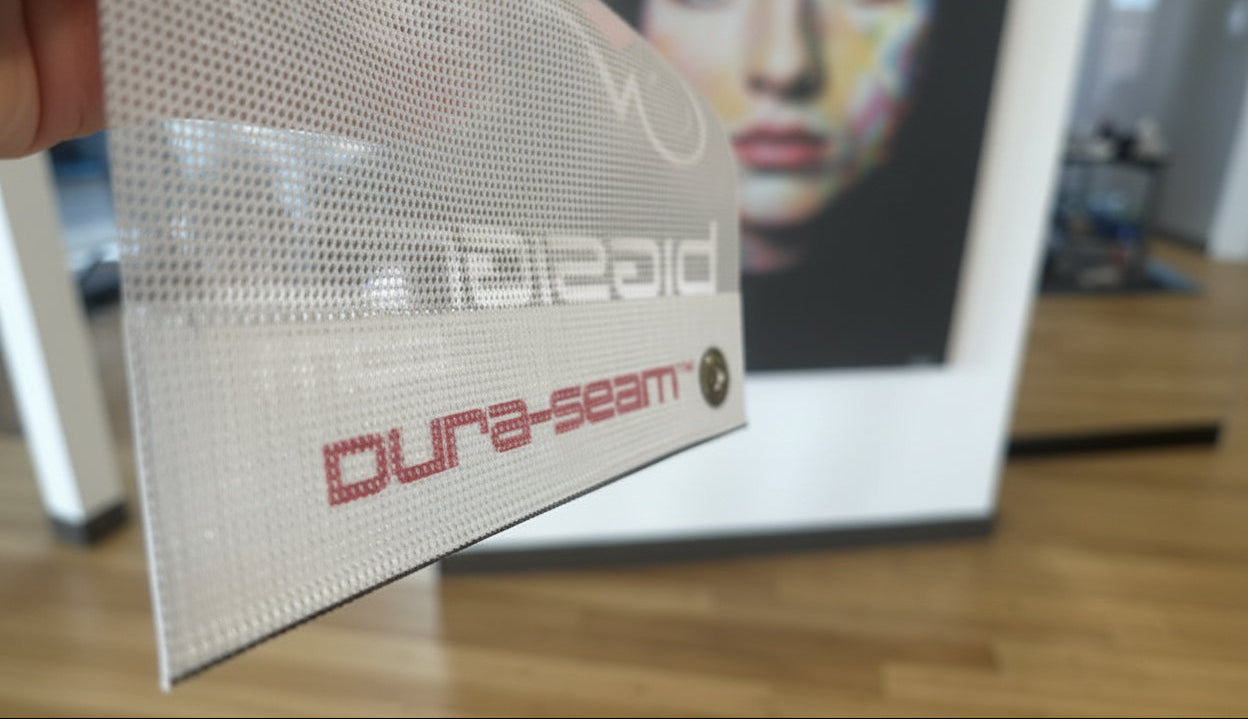 Duraseam mesh fence windscreen with bold athletic graphics — ideal for stadiums, locker rooms, gyms or sports fields.