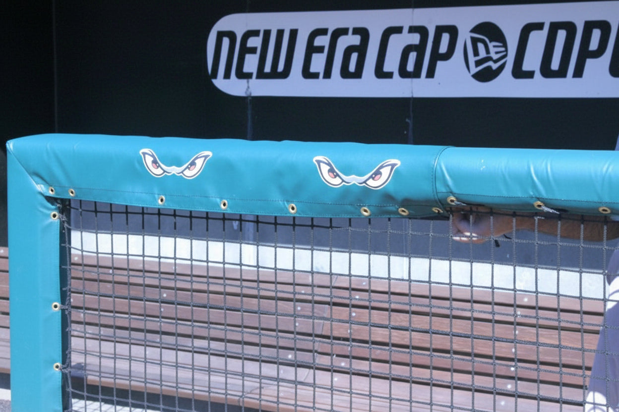 Goal post and rail padding with custom graphics providing athletic field safety, team branding, and enhanced stadium visuals.