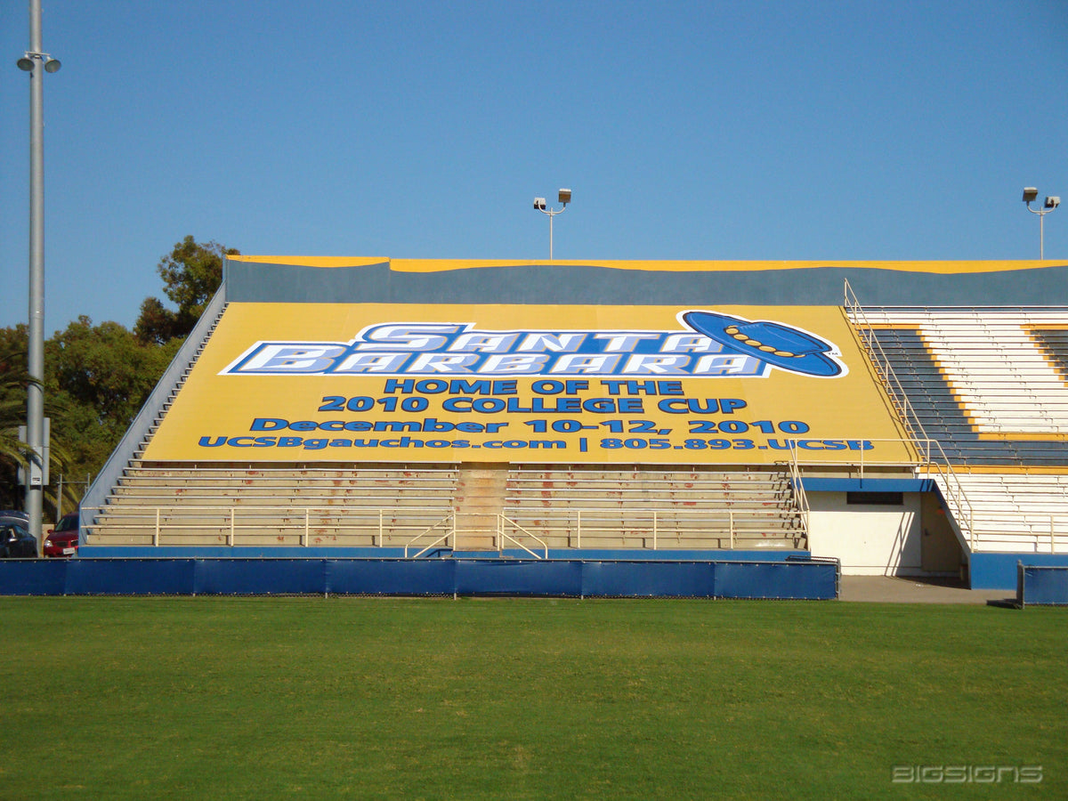 Yellow Santa Barbara 2010 College Cup section cover over a stadium's bleachers