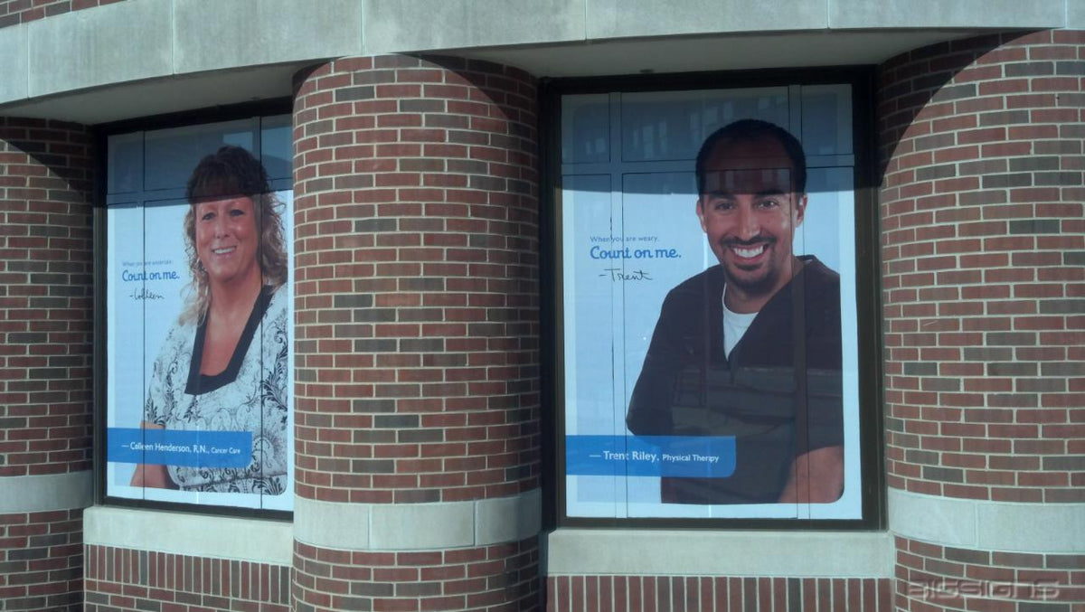 Count on me. portrait window graphics of staff in a brick building's windows