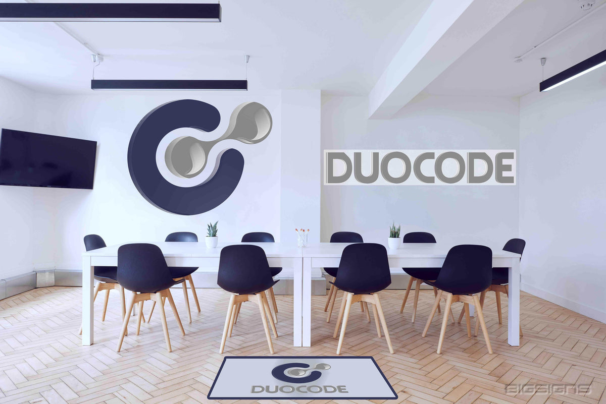 Gray Duocode logo and wordmark on the wall of a bright conference room