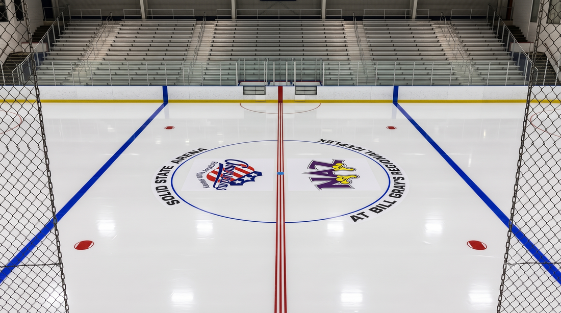 In-ice center circle graphic showing the arena name and two competing team logos printed on a hockey rink surface