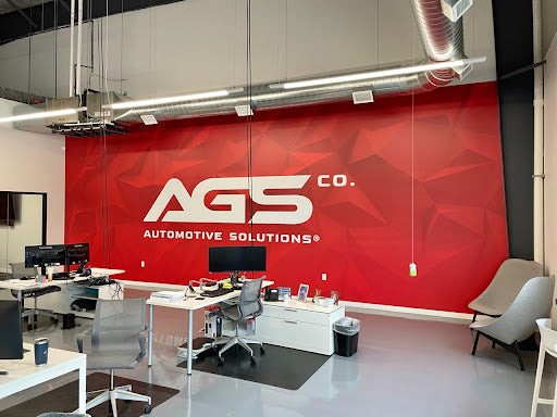Custom wall graphics and window wraps enhance office decor and boost brand visibility in a modern corporate workspace.