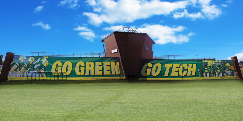 Football field bleachers wrapped with Duramesh bleacherskin at Arkansas Tech, showing bold school spirit and sports branding.