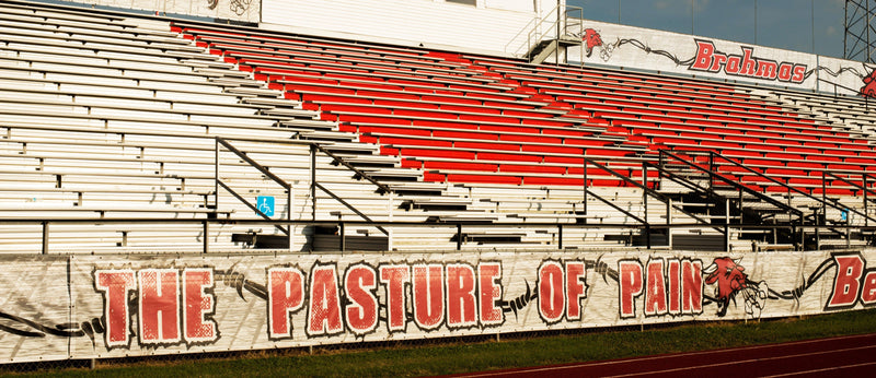 Bellville football bleachers wrapped in Duramesh bleacherskin featuring school colors and dynamic game-day branding.