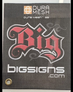 Black DuraMesh sample with BigSigns branding and metal grommet, showing durable perforated mesh banner material close-up.