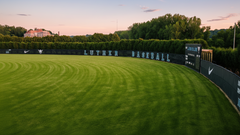 Gator branded athletic windscreen graphic on fence, ideal for athletic windscreen and fence screen in sports venues