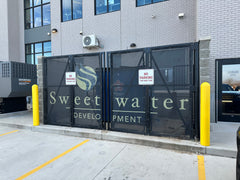 Custom sports windscreen with bold graphics on fence, perfect for athletic fields, stadiums, sports facilities, gyms & events.