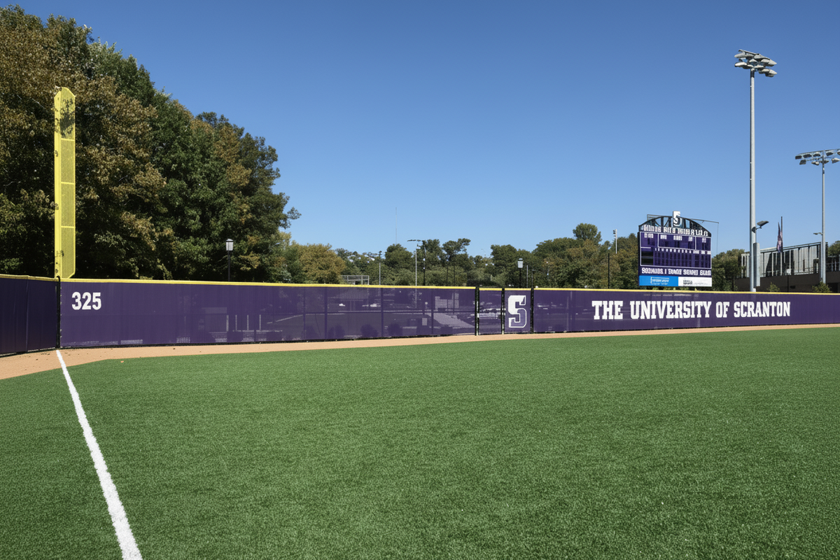 Custom athletic windscreen with bold sponsor branding on fence, ideal for fence screen and athletic windscreen display