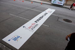 Durable asphalt surface floor decals with bold graphics, perfect for floor decals and outdoor event banners display