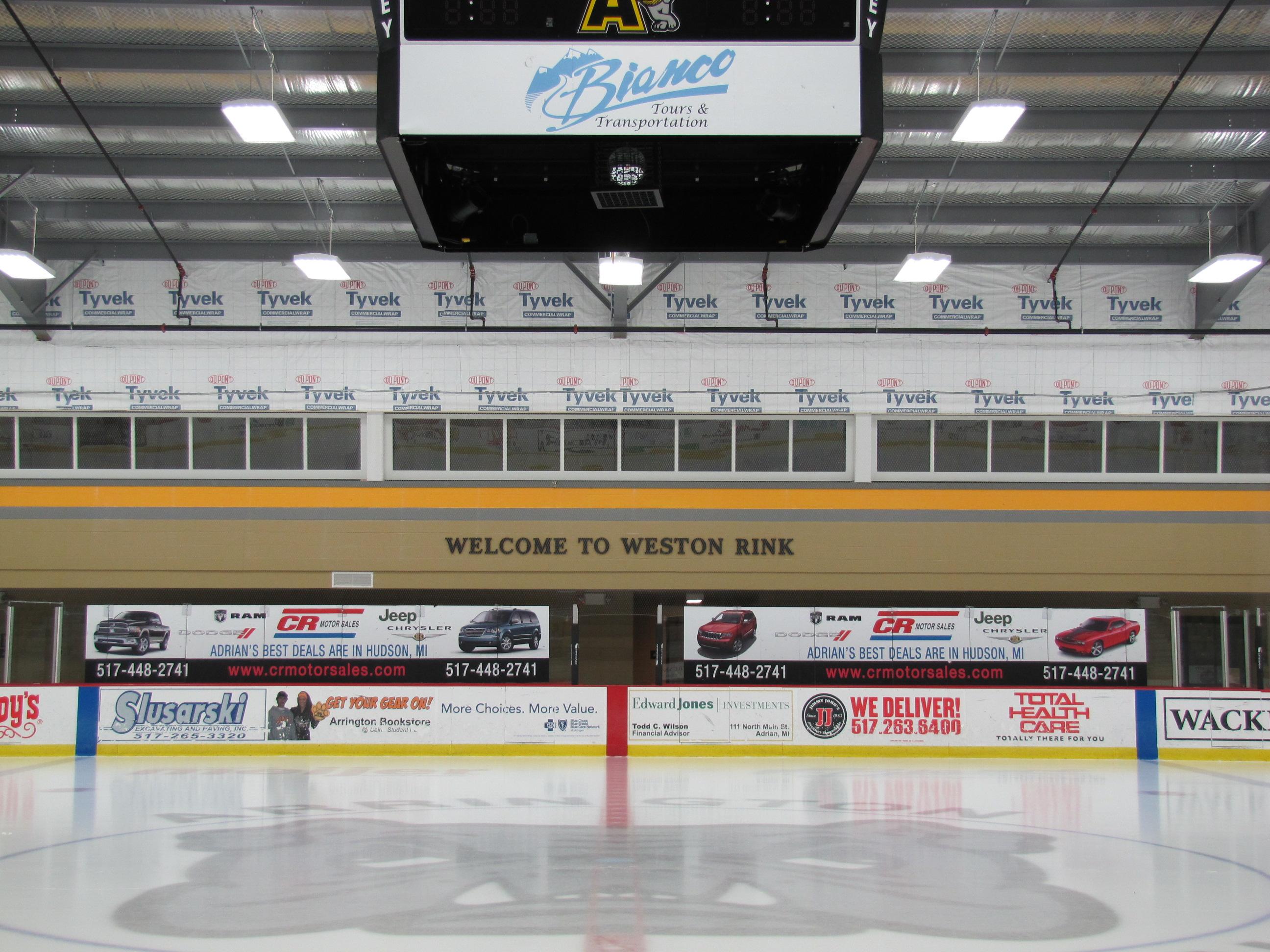 Sports arena dasher board advertising with custom graphics, ideal for event banners and wall wraps applications