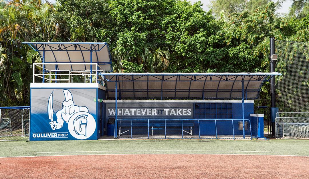 Dugout graphics wrap showcasing full-color custom branding on baseball facility dugout front for team identity & venue décor.