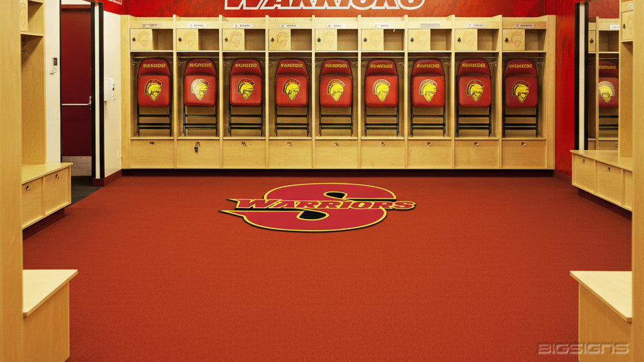 Red Warriors logo MojoMat™ floor mat in a red-carpeted locker room with wood stalls