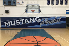 Indoor gym pads installed on wall for safety and branding, ideal for gym pads and weight room graphics in athletic facilities