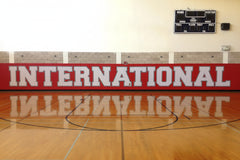 Custom indoor wall padding with bold graphics, perfect for gym pads and wall wraps in sports and training environments