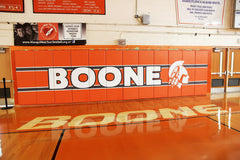 Protective gym pads with printed designs on indoor walls, ideal for gym pads and weight room graphics applications