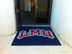 Navy LMU logo rug at the glass entrance doors of a campus building