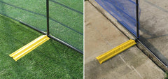Steel temporary fencing installed outdoors on green turf, ideal visual for crowd management and outdoor site security planning.