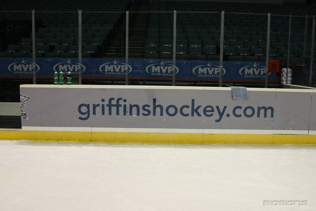 Ice rink window graphics with sponsor branding, ideal for window graphics and event signs in sports arena environments