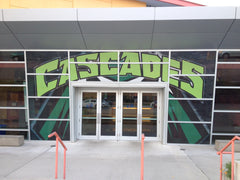 Athletic fence graphic featuring a large, detailed tennis ball hitting a net, designed for tennis court privacy.
