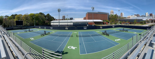 Custom windscreen with bold graphics on fence, ideal for athletic fields, stadiums, sports facilities, gyms & outdoor events.